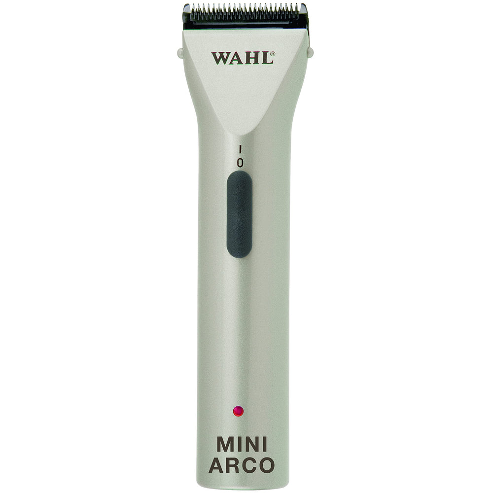 Wahl MiniArco trimmer in hand for precise pet grooming on faces