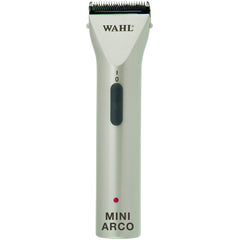 Wahl MiniArco trimmer in hand for precise pet grooming on faces