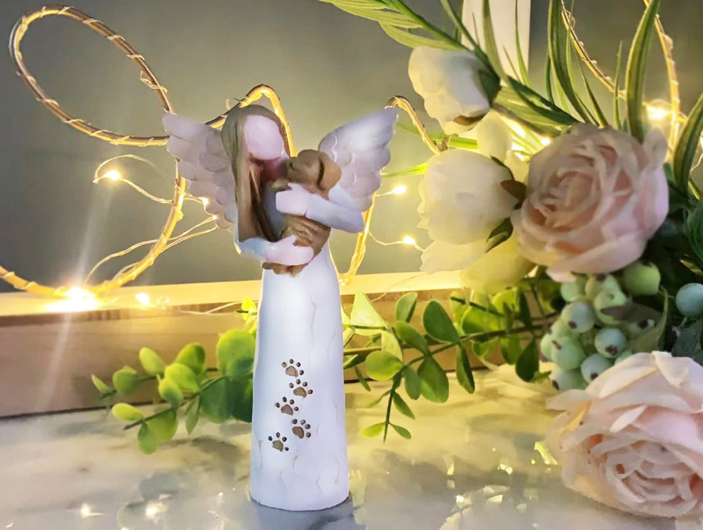 Waifugal dog memorial angel statue by the fireplace adds warm, reflective ambiance