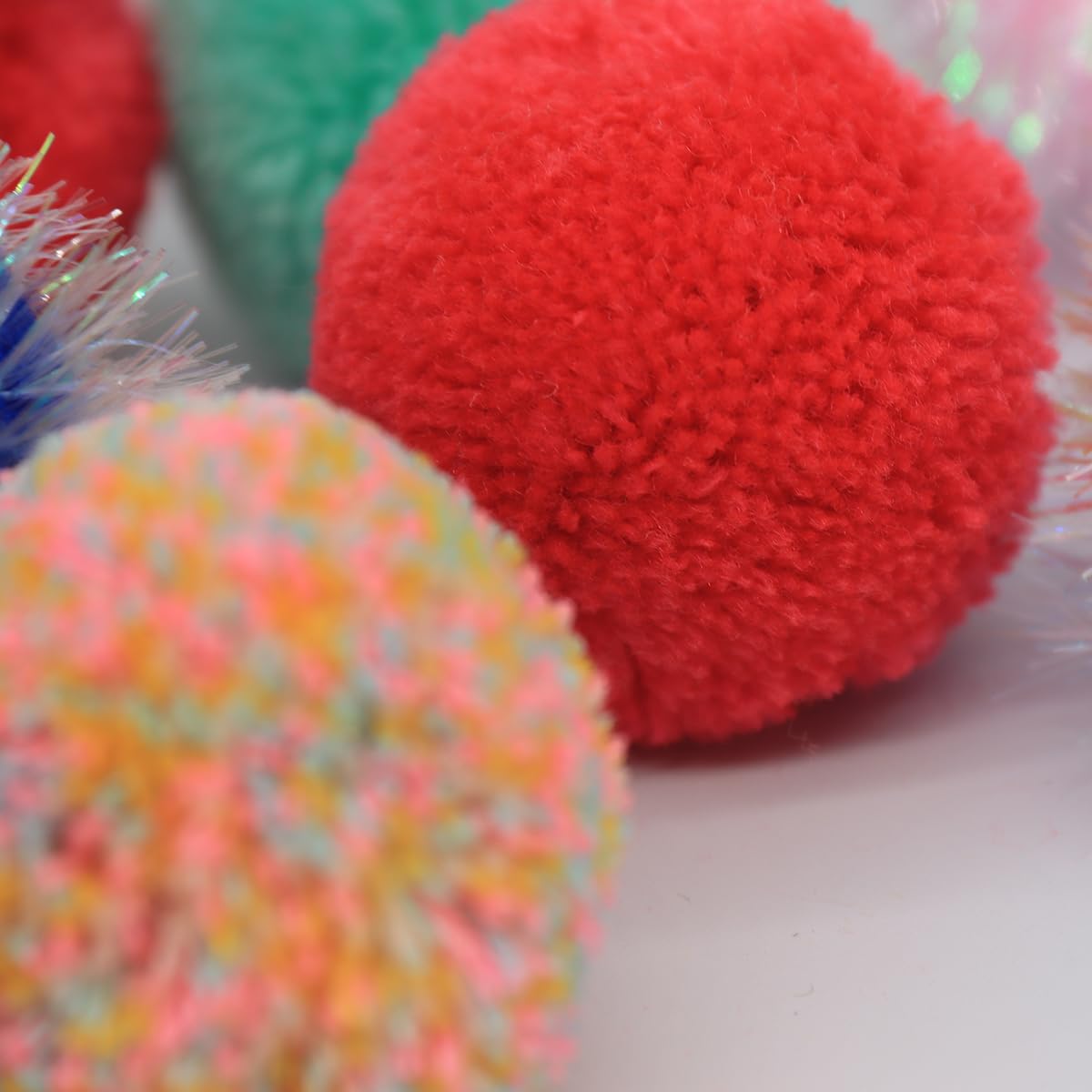 WaoDoing colorful pom-poms ball set in action encourages color-rotation for renewed interest.