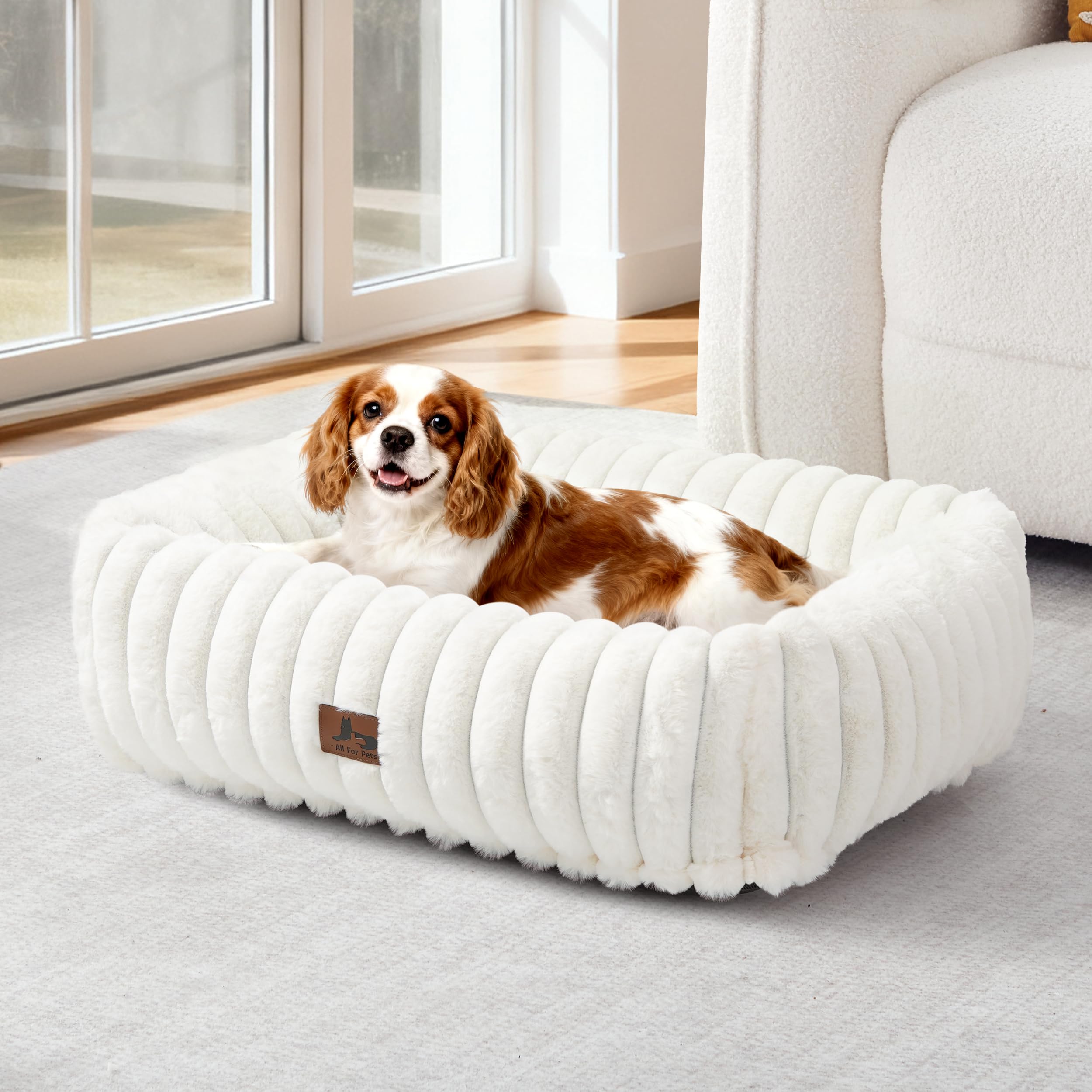 Warmrest washable dog bed side view in cream with raised edges for cozy neck support