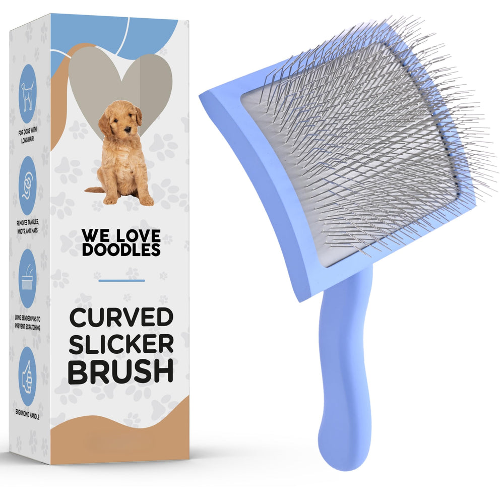 We Love Doodles curved slicker brush close-up with ergonomic handle for comfortable grooming