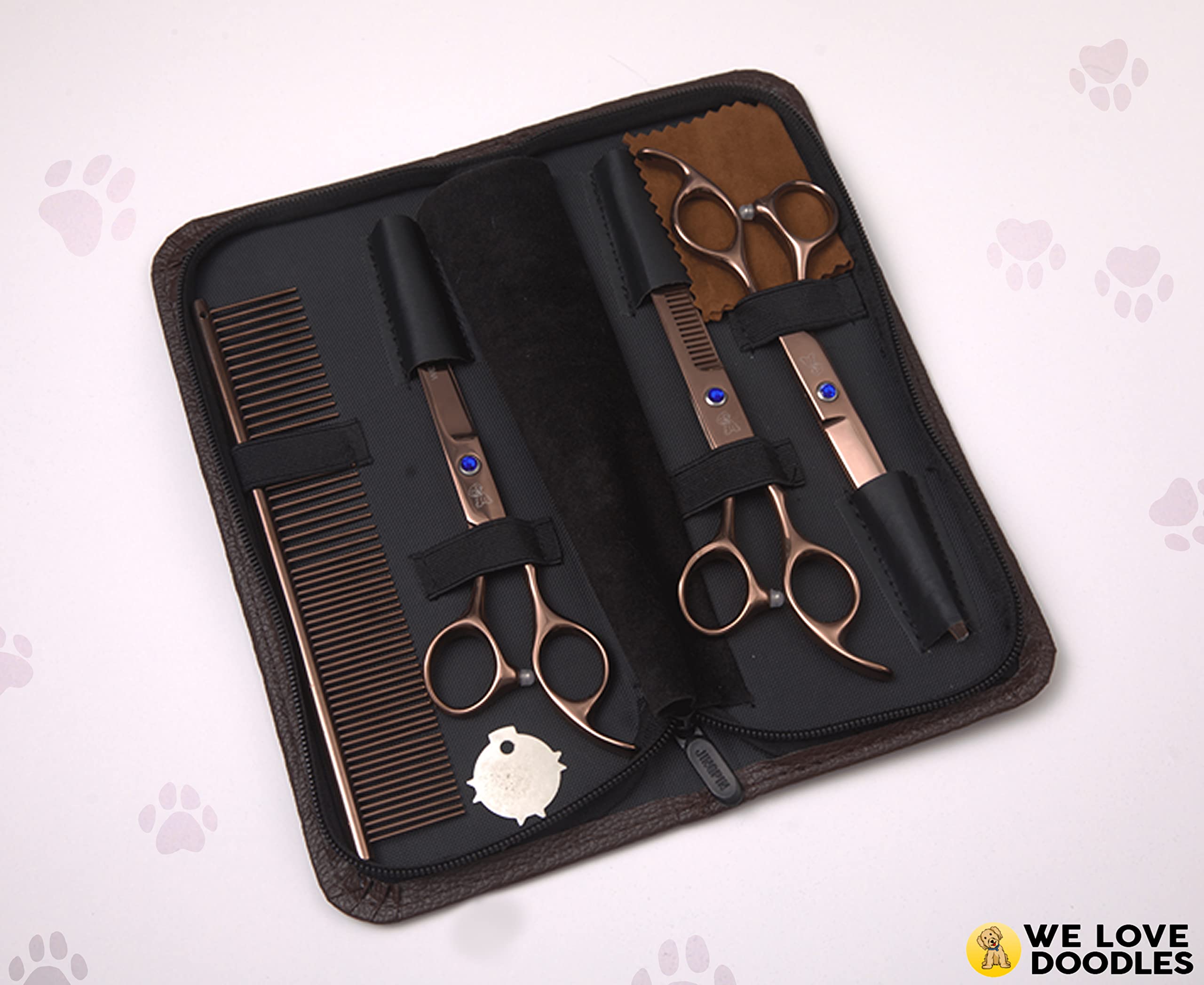 We Love Doodles dog comb detangling fur before trimming for smoother cuts.