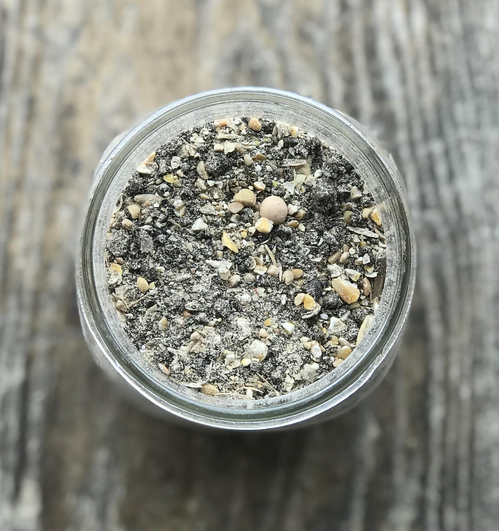 Wholesome Harvest bag open showing grain blend for robust growth