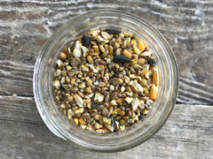 Wholesome Harvest herbal health support photo featuring oregano and garlic for digestion-friendly feed.