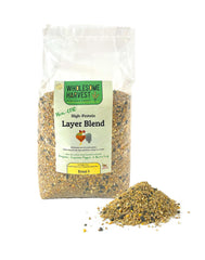 Wholesome Harvest non-GMO layer blend bag front shows ready-to-use poultry feed for steady laying