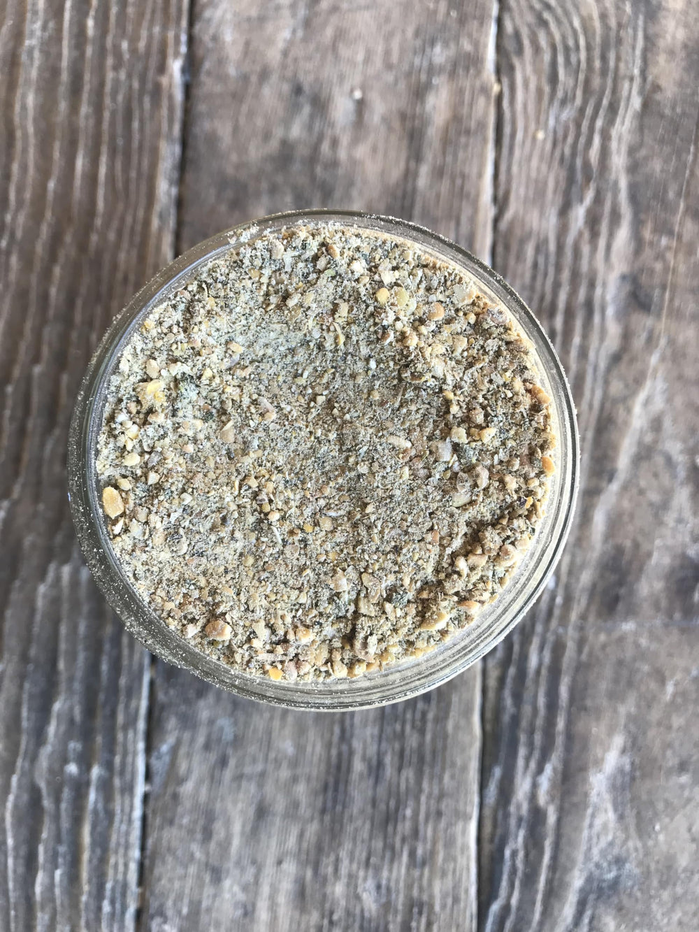 Wholesome Harvest quail layer feed ingredients close-up highlights wholesome grains for balanced nutrition.