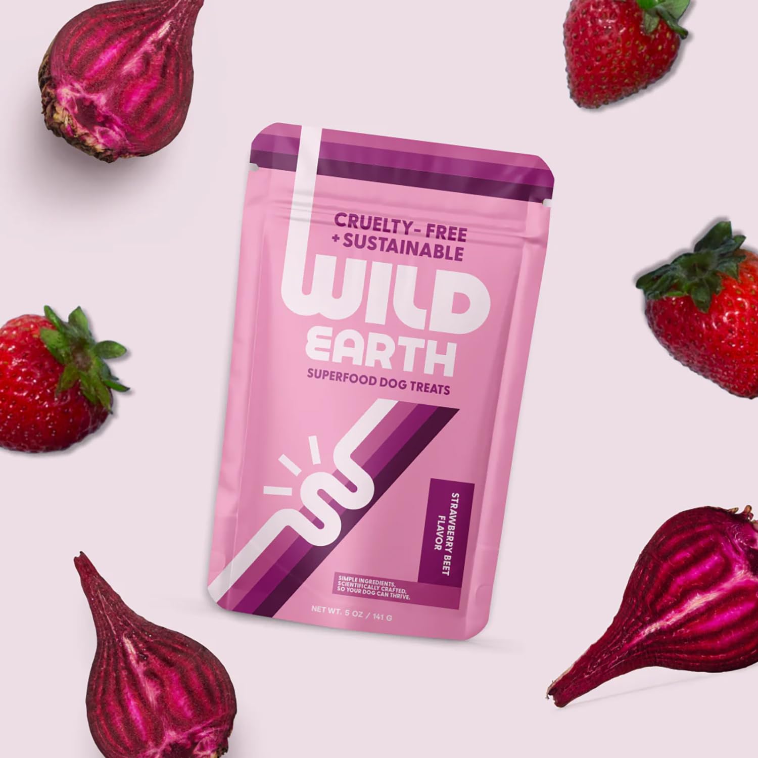 Wild Earth Superfood Dog Treats strawberry-beet flavor close-up appealing to dogs.
