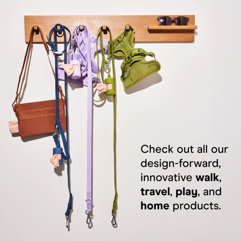 Wild One Treat Pouch on-the-go use at the dog park in black.