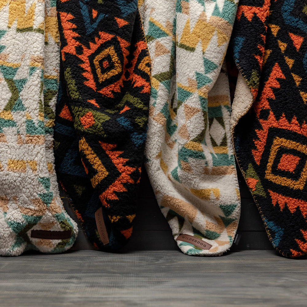 Wilderdog blanket in campsite setup for outdoor comfort.