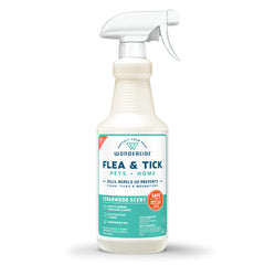 Wondercide flea tick spray bottle near a dog for natural pest control.