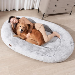 WOZOKE Human Dog Bed giant size beside a couch offers shared lounging for family moments.