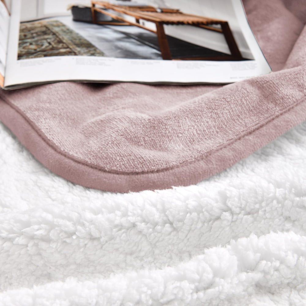 Yaning double-sided blanket showing Sherpa side for plush warmth in living spaces.