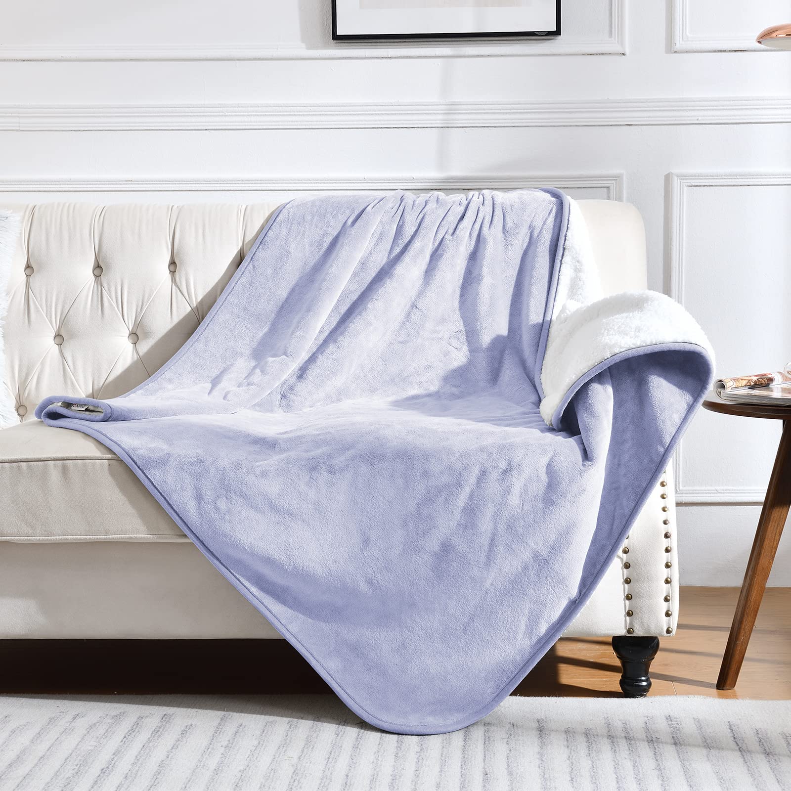 Yaning waterproof blanket on lilac bed shows leakproof protection and plush warmth