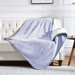 Yaning waterproof blanket on bed protects against spills and pet fur.