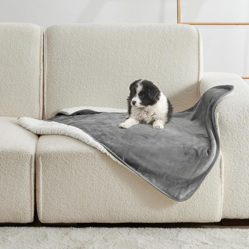 Yaning Waterproof Blanket on bed protects against spills and pet accidents.