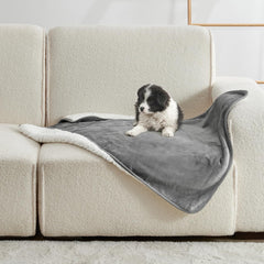 Yaning Waterproof Blanket on bed protects against spills and pet accidents.