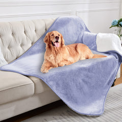 Yaning blanket on sofa demonstrates pet-friendly protection against spills and fur