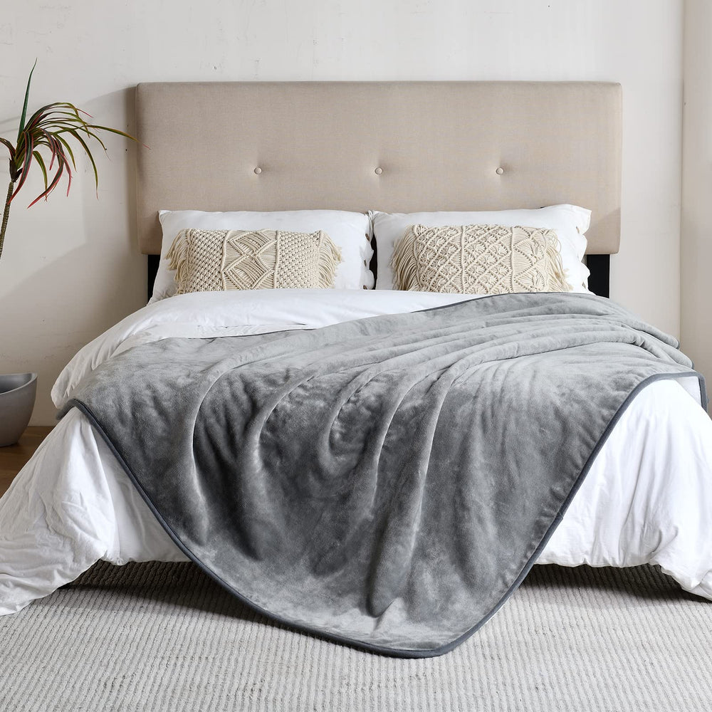 Yaning waterproof coating inside blanket blocks liquids while keeping outer surfaces soft.