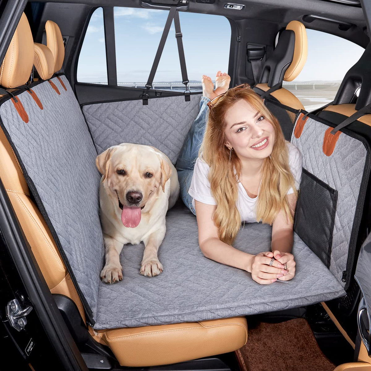 YJGF back seat extender cover on back seat creates a comfy car bed for dogs during rides.