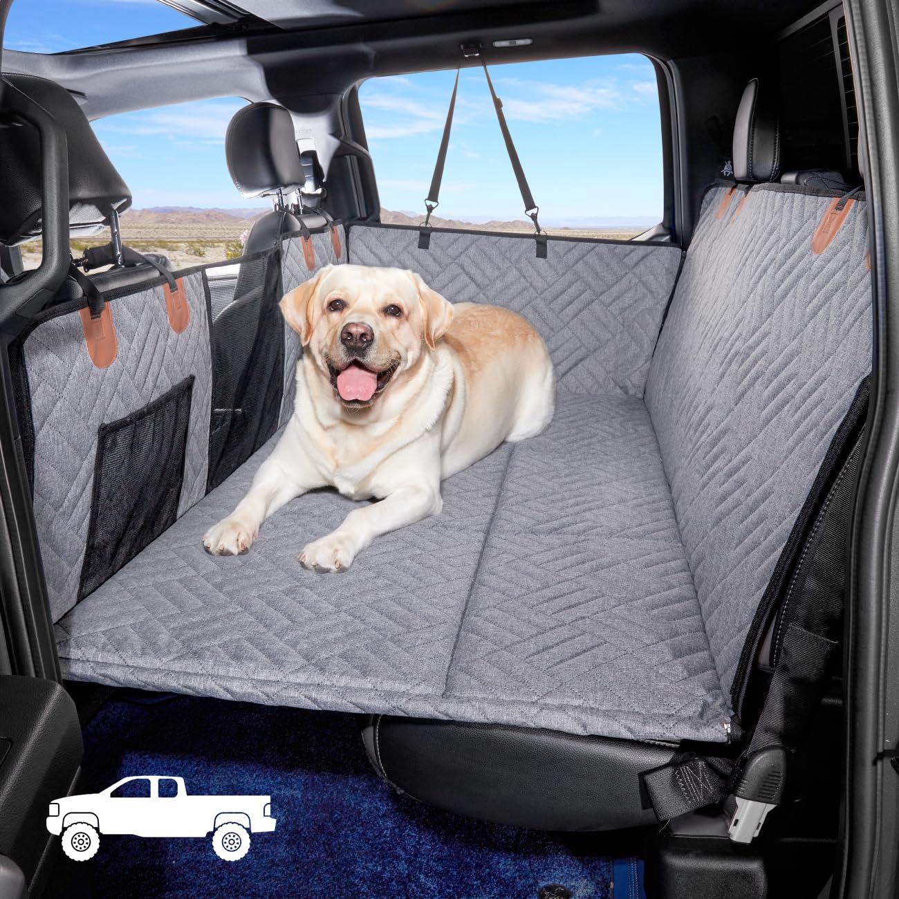 YJGF dog back-seat extender in truck bed creates a roomy bed for road trips.