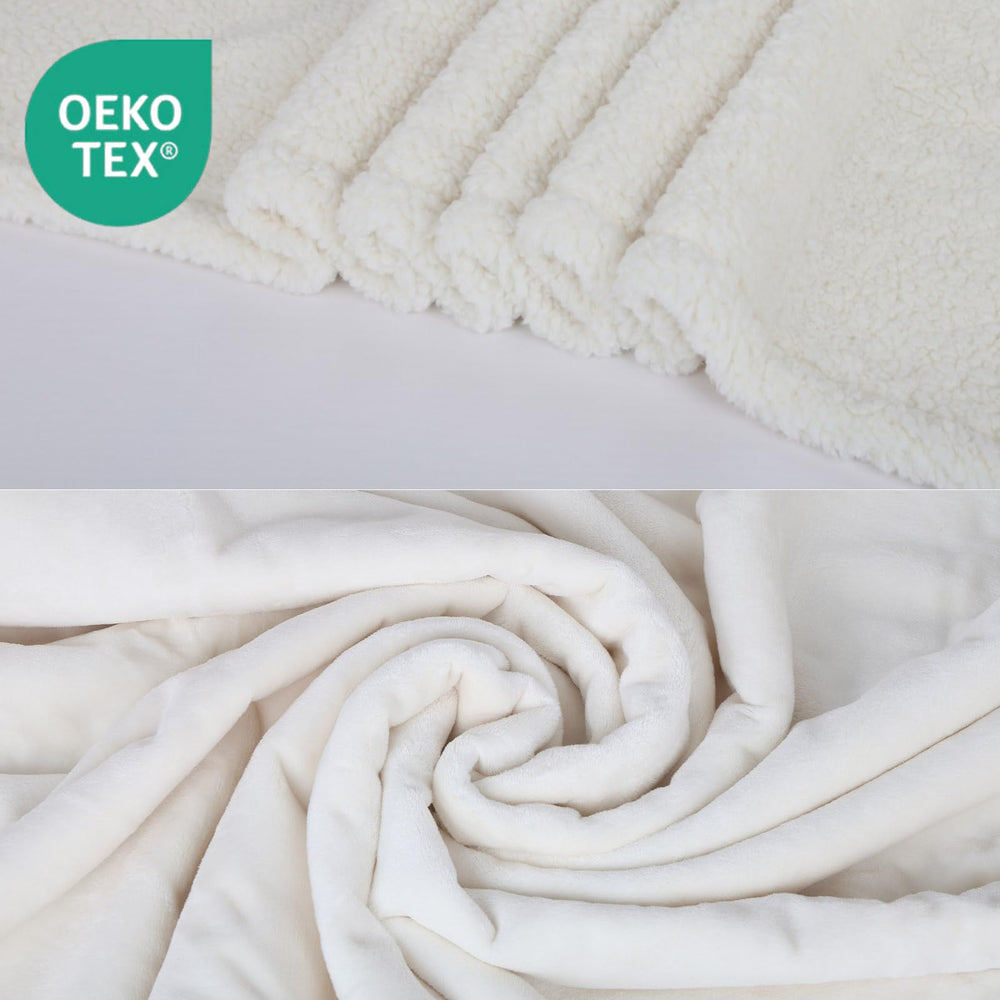 ZAKAPAWS sherpa fleece reversible blanket showing plush warmth on a couch