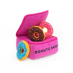 ZippyPaws Burrow Donutz Miniz squeaks engage during playtime.