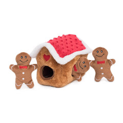 ZippyPaws Burrow gingerbread house open with Miniz visible for hide-and-seek enrichment.