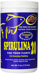 Zoo Med Spirulina 20 Flakes bottle shows high-protein color-enhancing fish food in use