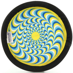 ZooBee disc in mid-air showing long-throw potential for games.